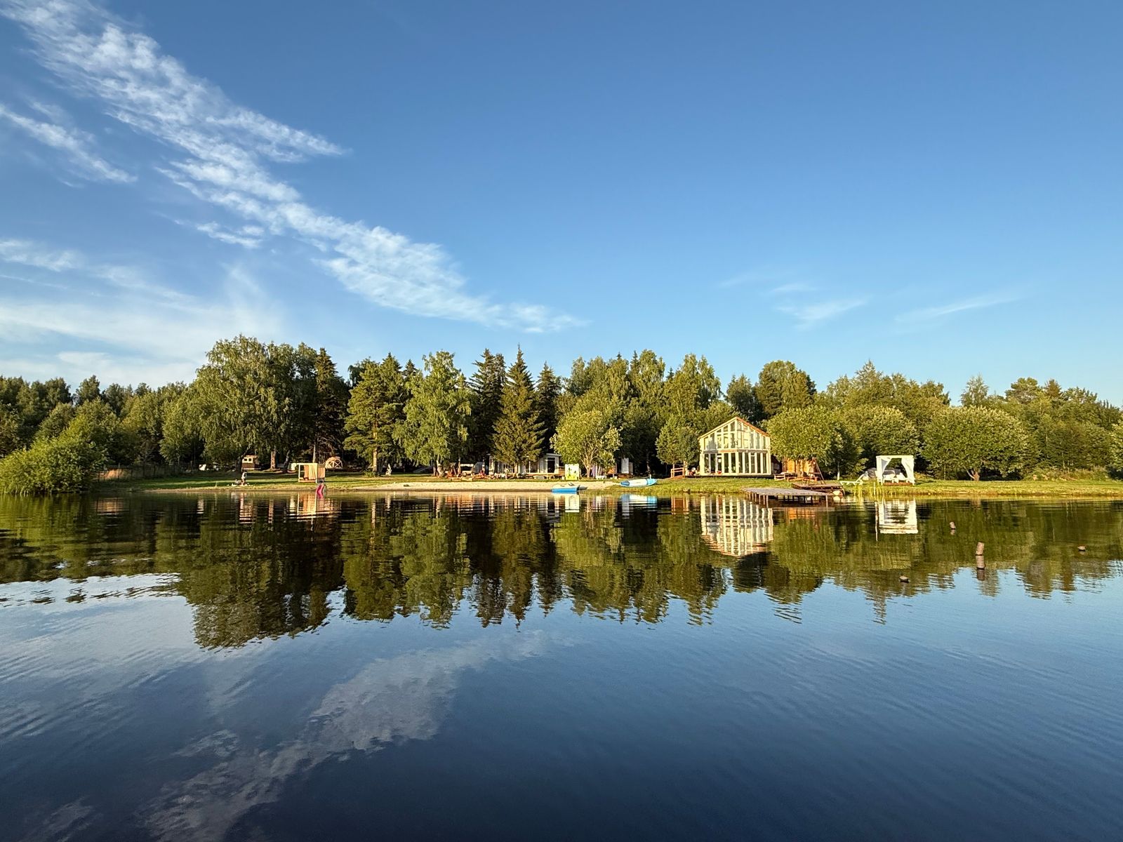 Вогульское водохранилище и берег базы с воды